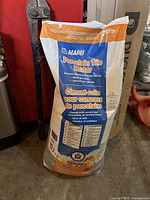 Photo of one bag of Mapei Porcelain Tile Mortar in blue, orange and white packaging marked as waterproof and suitable for porcelain tiles.