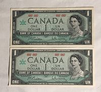 Front view of two Canadian $1 Centennial bills showing Queen Elizabeth II portrait and bilingual text with centennial years 1867-1967.