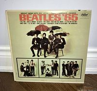 Front of the Beatles '65 album sleeve showing band photos and track listing.