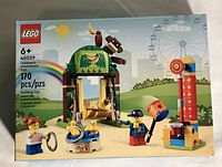 Front view of Lego set 40529 box showing 170 pieces and recommended age 6+. Box features images of amusement park rides and minifigures.