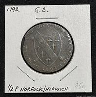 Obverse side of 1792 Norfolk and Norwich half penny token showing shield and inscriptions.