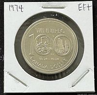 Reverse side of the 1874-1974 Canada 1 Dollar coin commemorating the 100th anniversary of Winnipeg, showing city imagery and denomination.