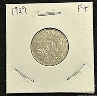 Reverse side of 1929 Canadian nickel showing 'Five Cents' denomination, maple leaf design, and year '1929'.