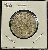 Reverse side of the 1963 Great Britain two shillings coin showing the crowned floral design and denomination.
