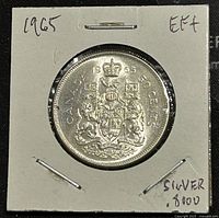 Reverse side showing Canadian Coat of Arms, denomination '50 CENTS', and year '1965'.