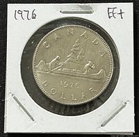 Reverse side of the 1976 Canadian 1 dollar coin featuring canoe scene with two paddlers and inscriptions.