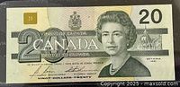 Front side of the banknote showing Queen Elizabeth II portrait with '20 Canada' and signatures, dated 1991 in Ottawa.