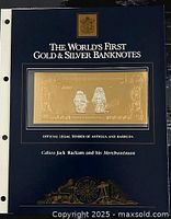 Banknote mounted in dark blue display page titled 'The World's First Gold & Silver Banknotes'