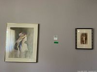 Overview shot showing both framed artworks hung side by side