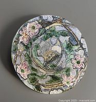 Top-down close-up of the large Weller console bowl showing intricate raised hand-painted floral and leafy vine details with nest design in the center.