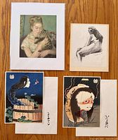 Overview of all four prints: Renoir matted print, Kamiyaki charcoal drawing, two colorful Hokusai yokai reprints with envelopes