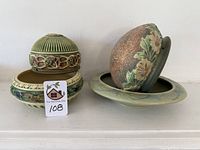 Roseville Corinthian bowl with removable flower frog stacked beside a shallow green bowl