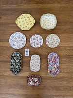 Group photo of nine Royal Winton ceramic items including plates, trays, and a butter dish with various floral patterns.