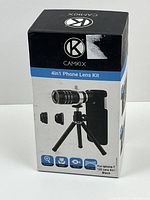 Front of CAMKIX 4in1 Phone Lens Kit box showing 12X zoom telephoto lens on small tripod and listing compatible phone model iPhone 7.