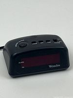 Front view of the Westclox digital alarm clock with red display and brand label.