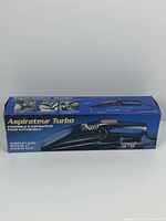 Box showing front panel of hand-held auto detailing turbo vacuum cleaner with product images and text in English and French.