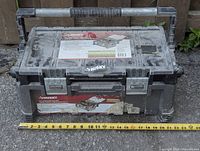 Top view of Husky tool box with product label and built-in lid compartments, measuring approximately 19 inches wide