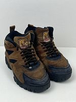 Front view of pair of Kodiak work boots showing shapes, color, laces and logo on tongues