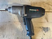 Front and side view of the Mastercraft 7.5 amp corded impact wrench showing the brand label and general wear condition.