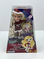 Front view of new sealed Bratz Holiday Doll named Cloe in holiday attire in original clear plastic and cardboard packaging.