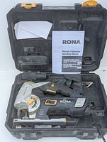 Rona Redeye 6 Amp Orbital Jigsaw in black and gray with orange accents, shown in an open carrying case with instruction manual.