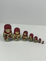 Full set of 7 nested Russian nesting dolls in order of size
