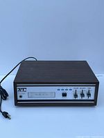 Front view of the vintage AITC 8 Track cassette player showing control panel with program button, headphone jack, and sliders for volume, balance, and tone.