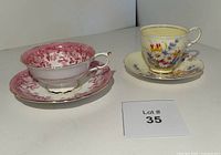 Both Paragon bone china teacup and saucer sets positioned side by side, showing overall design and size comparison