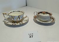 Pair of vintage bone china teacups and saucers on white background; Royal Albert on left and Royal Chelsea on right