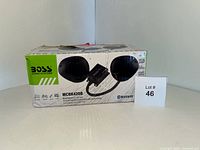 Box front showing Boss Audio Systems branding, model MCBK420B with image of speakers and amplifier