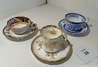 Photo of three vintage English teacup and saucer sets grouped together showing front and side views.