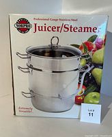 Front packaging of Norpro professional gauge stainless steel juicer/steamer showing image of the 3-tier unit with lid and drainage hose attached.
