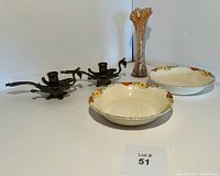 Overview of the lot showing both bowls, glass vase, and brass candle holders arranged on a white surface with lot number.