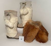 Front and side view of Ralph Lauren beige suede boots with thick white faux fur trim and pom-poms, paired with vintage red fox fur mittens showing mixed reddish-brown fur.