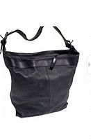 Front view of the black leather Banana Republic handbag showing its structured, slightly slouchy shape and wide shoulder strap.