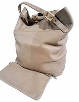 Front view of ivory leather tote bag with adjustable strap and removable pouch in front.