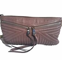 Front view of pink leather clutch showing two zippered pockets with leather pull tabs and chevron quilted design.