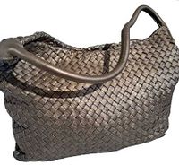 Woven dark brown leather handbag with single handle strap, showing front angle.