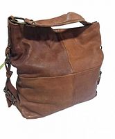 Front angled shot showing the soft brown leather, shoulder strap, and detailed patchwork