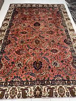 Full top-down view of entire rug on white tiled floor