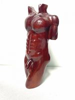 Front angled view of the hand carved solid mahogany male torso sculpture showing muscular detail.
