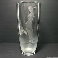 Full view of tall clear crystal vase with etched nude woman design.