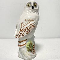 Front view of snowy owl figurine showing hand-painted details and molding