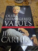 Jimmy Carter book titled 'Our Endangered Values' with cover showing a photo of Jimmy Carter