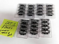 Top view of 7 packs of Gillette Mach3 razor blade cartridges in transparent blister packs showing black cartridge heads without the blue blades visible.