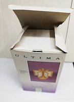 Closed box of Ultima picture frame caddy showing front panel with illustration of the product.