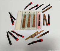 Overview of 22 assorted new old stock men’s and women’s leather watch bands. Includes braided and smooth styles in various shades of brown and black.