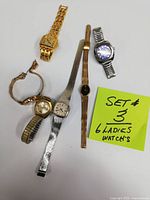 All six women's wristwatches arranged on a white surface with a yellow note stating 'SET #3 6 LADIES WATCH'S'