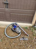 Full view of Dyson DC23 vacuum with hose, wand and floor nozzle