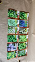 All twelve varieties of Burpee herb seed packets displayed in two rows